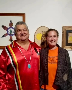 Chief Stacey LaForme with Sacha Gendron in front of Indigenous artwork