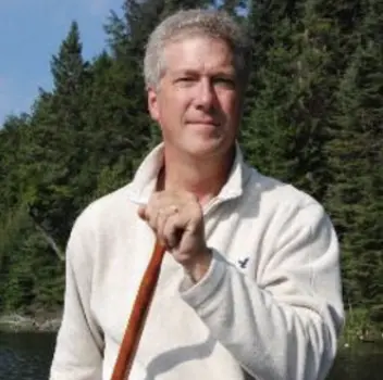 Rob Keen, former CEO of Forests Ontario, outdoors near water